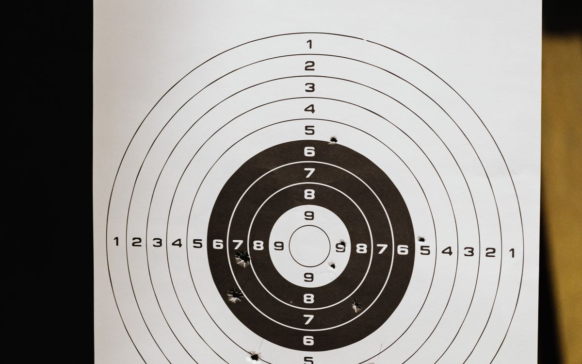 Bullet holes on a paper shooting target — reading vertical vs horizontal stringing