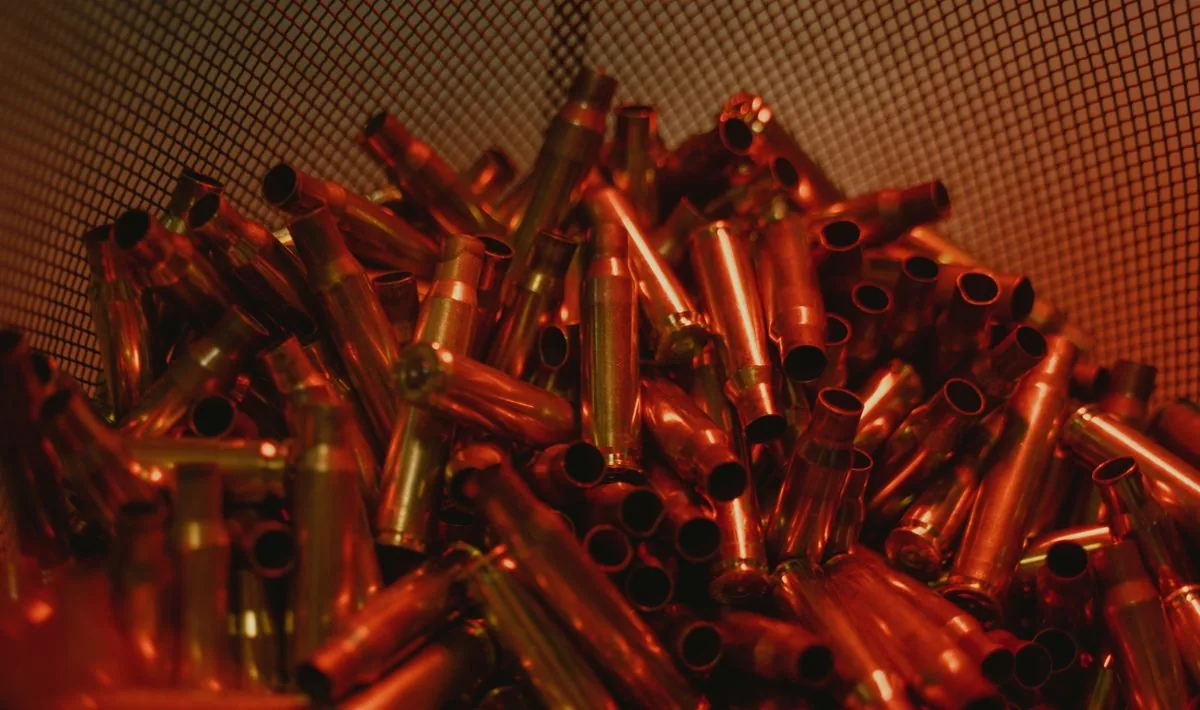 Annealing brass: rifle brass case necks under warm light, as in the annealing process