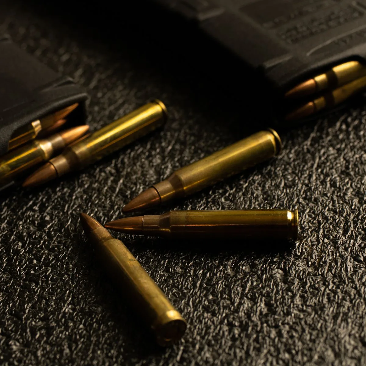 Seating depth and jump (CBTO): loaded rifle cartridges showing bullets seated in the case necks