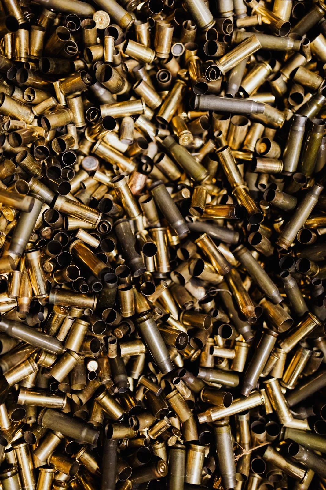 how many times can you reload brass - a pile of fired brass cartridge cases