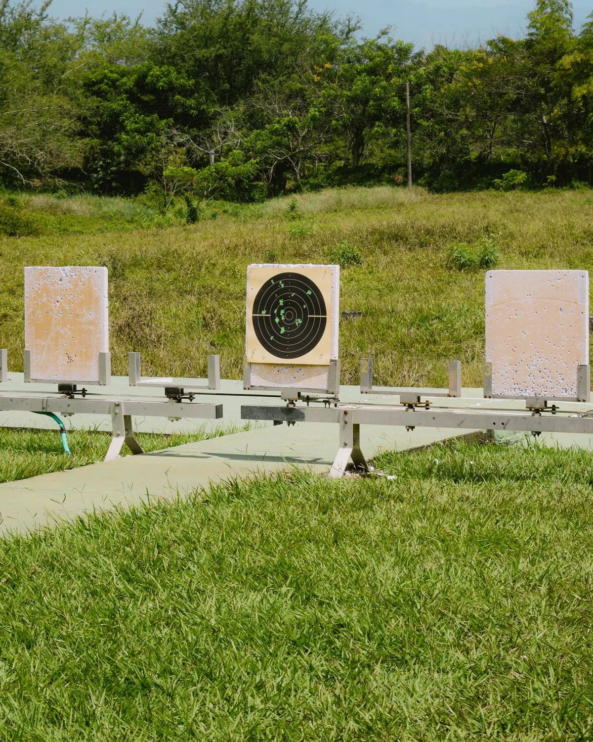 How to find a velocity node: an outdoor rifle range with paper targets downrange for load development