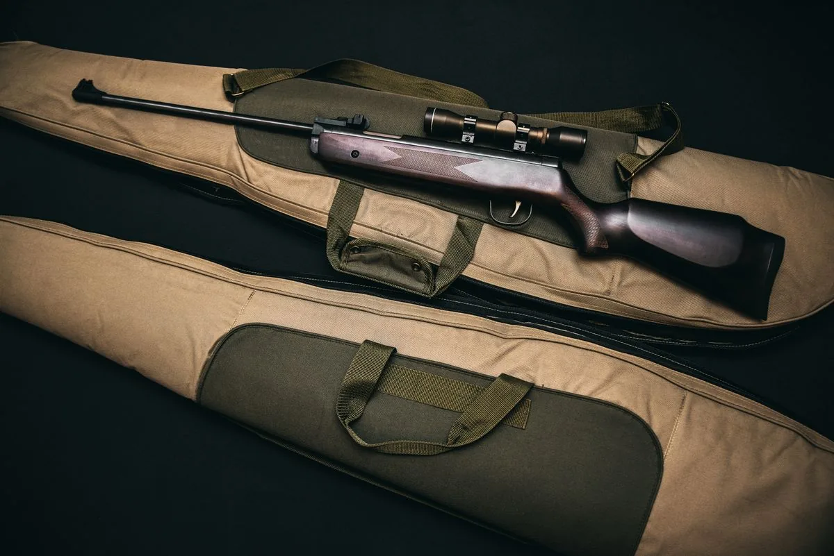 Barrel break in: a new scoped rifle in its case at the start of barrel break in