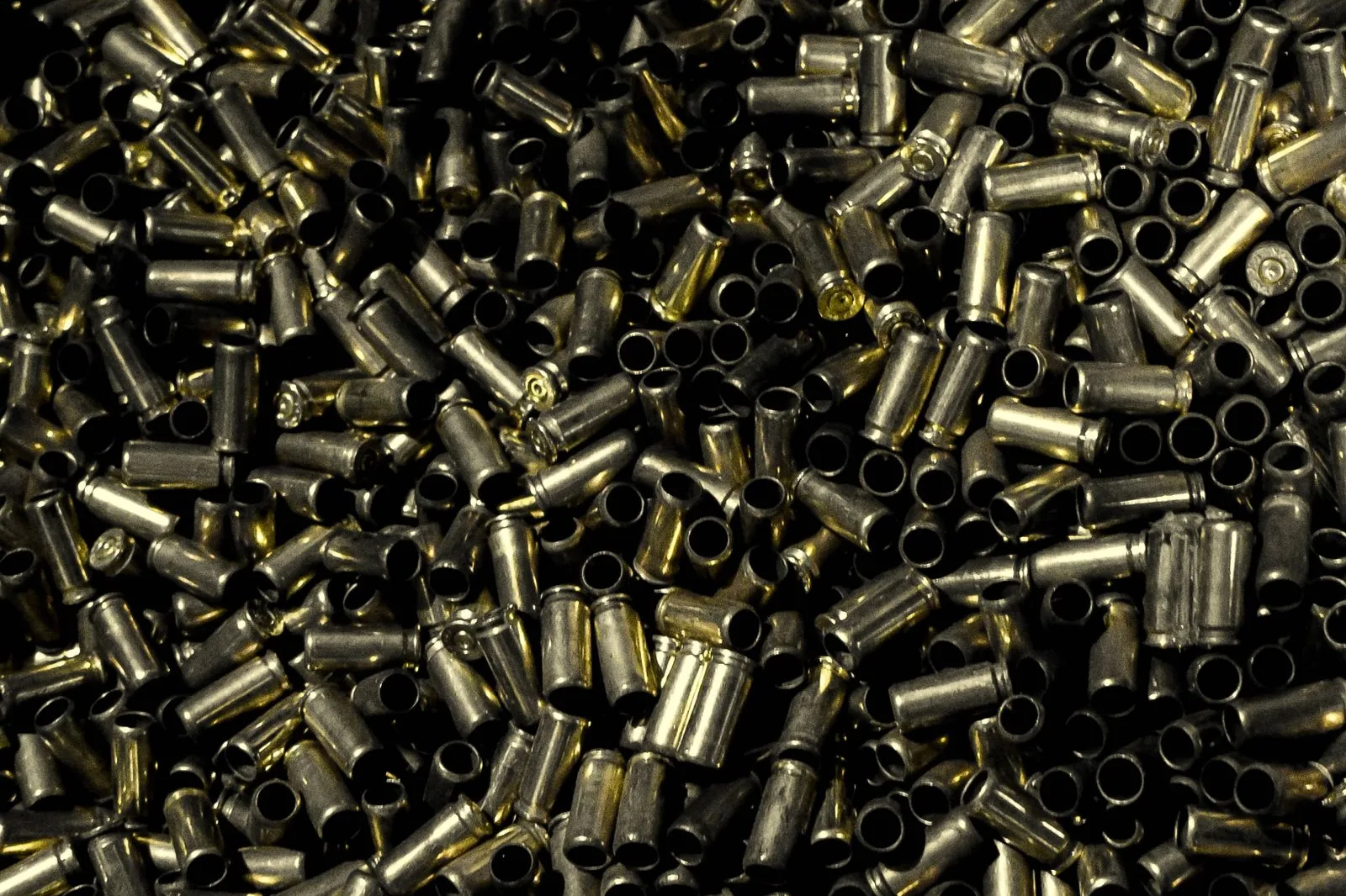 case trim length: a large pile of fired rifle brass cases