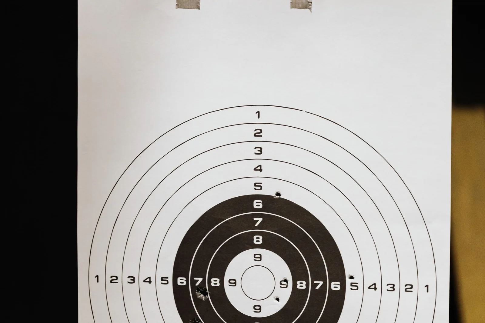 how many shots for load development: a paper target with a shot group